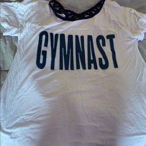 white gymnast tee with glitter blue words